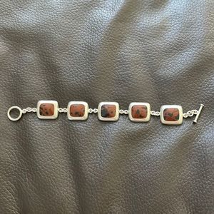 Silver bracelet with brown stone inlay